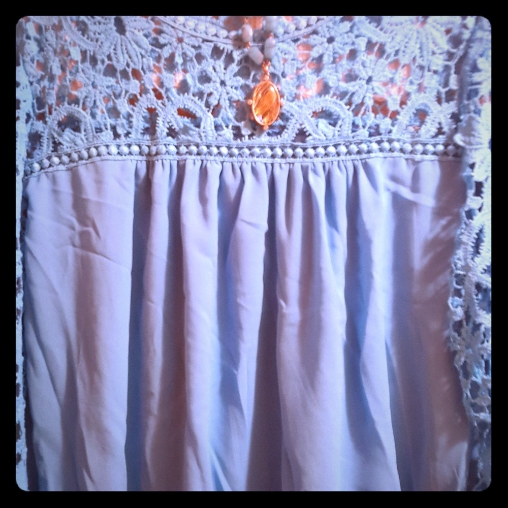 Turquoise laced blouse.